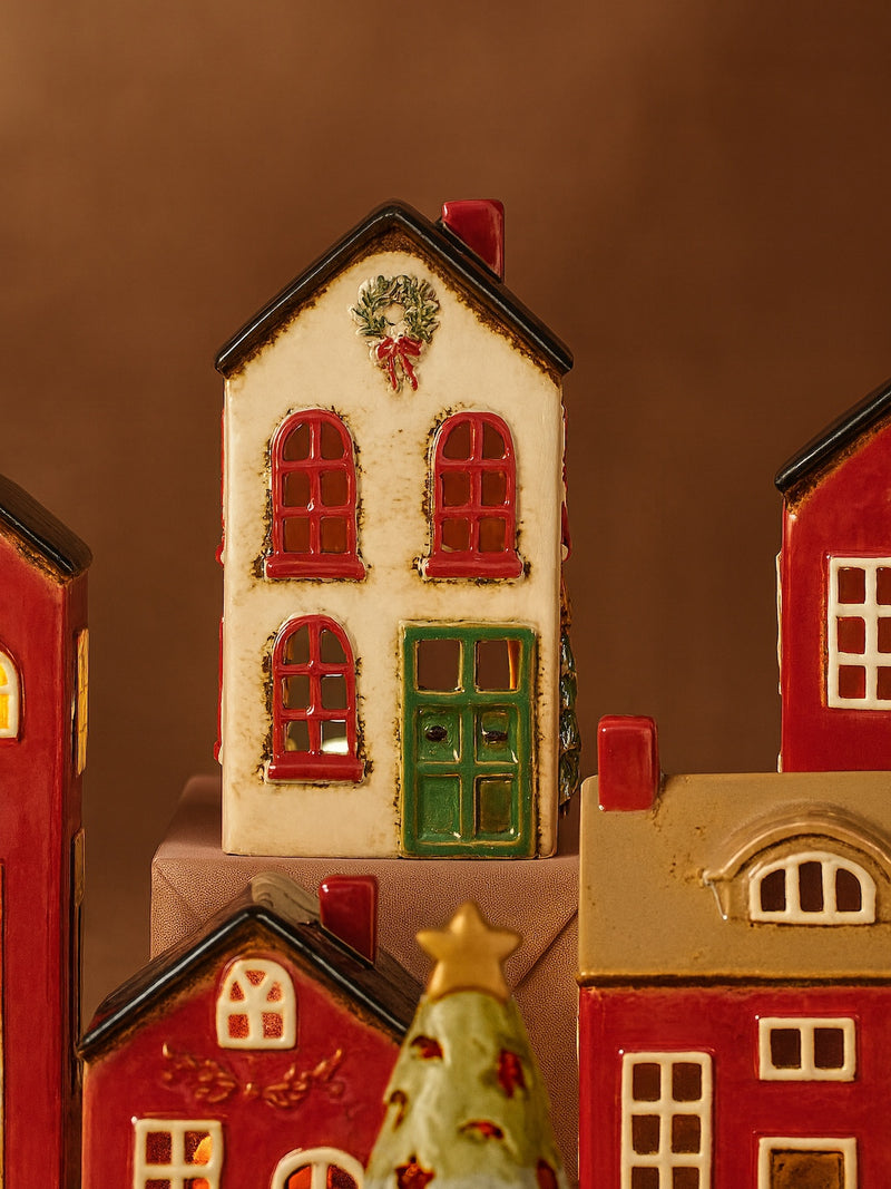 THATCH Living decorative white ceramic house tealight holder house with windows, door, and tree on a brown background by THATCH Living.