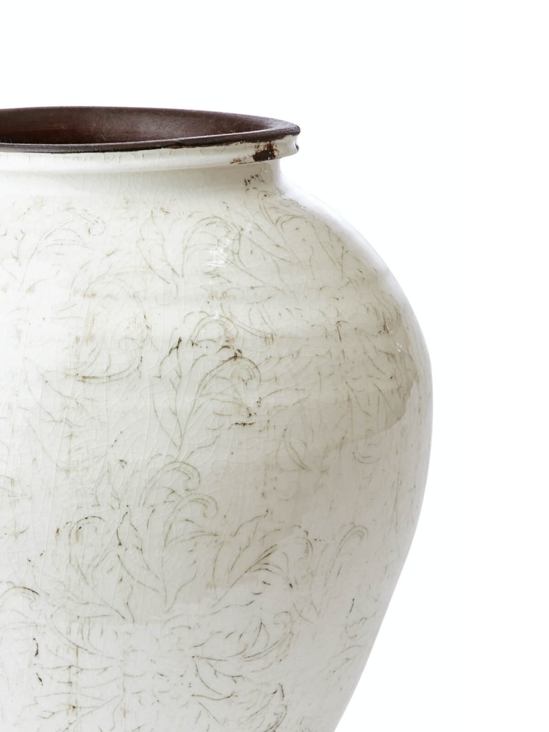 large white ceramic vase with floral details