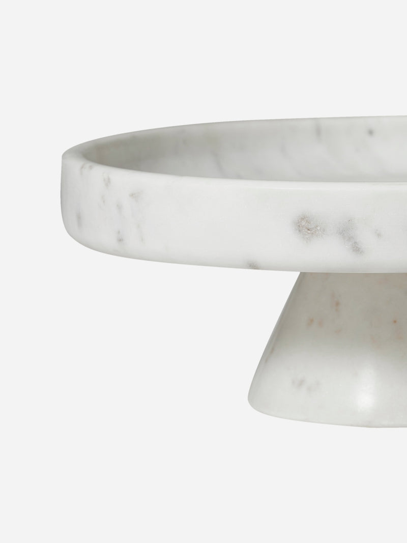 Marble cake stand on a white background