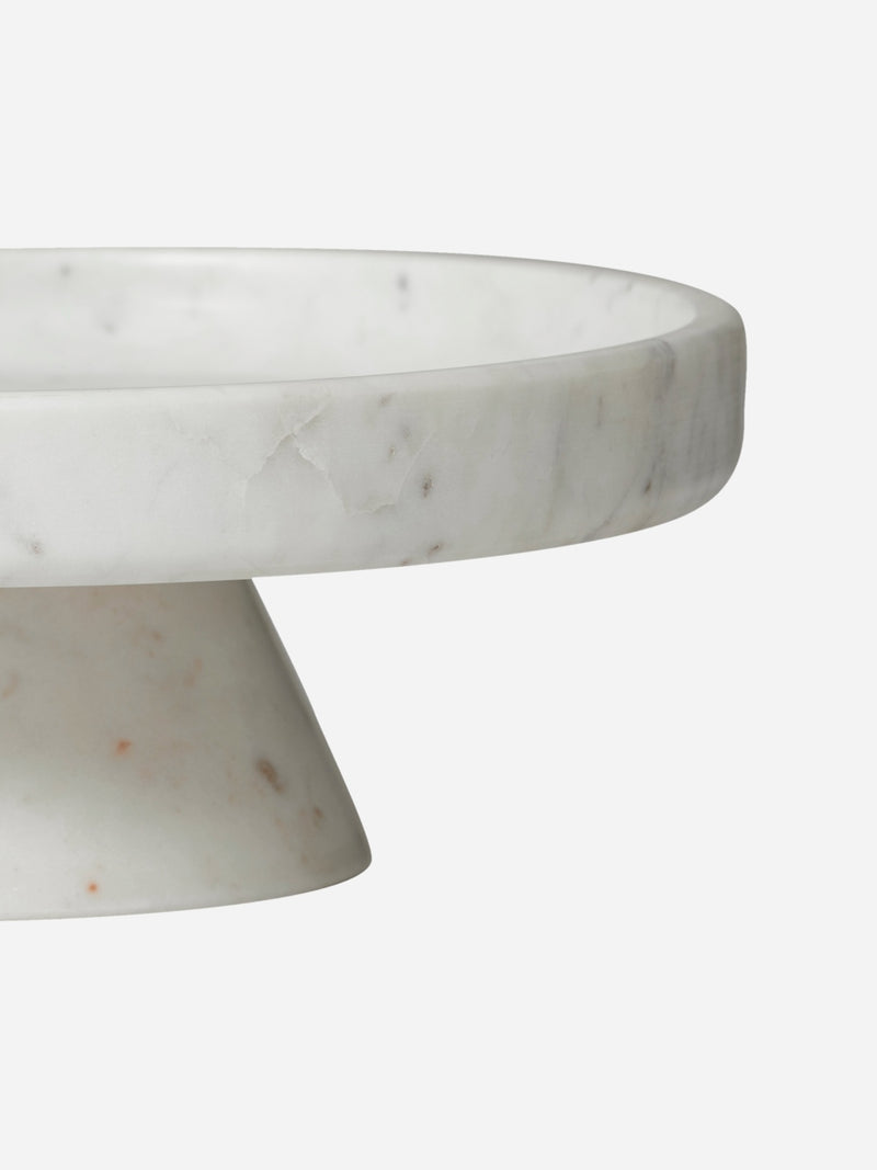 Marble cake stand on a white background