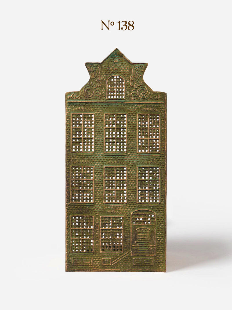 Decorative Canal House candle holder in metal panel by THATCH Living with architectural design on a white background