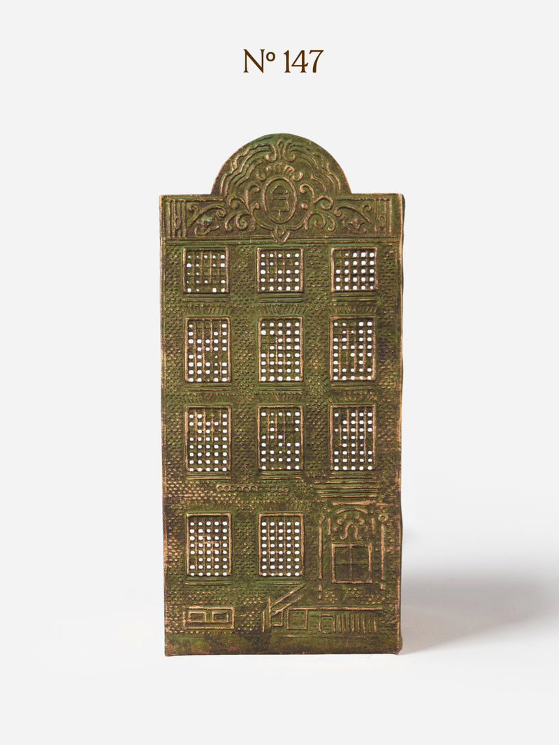 Decorative Canal House candle holder in metal panel by THATCH Living with architectural design on a white background