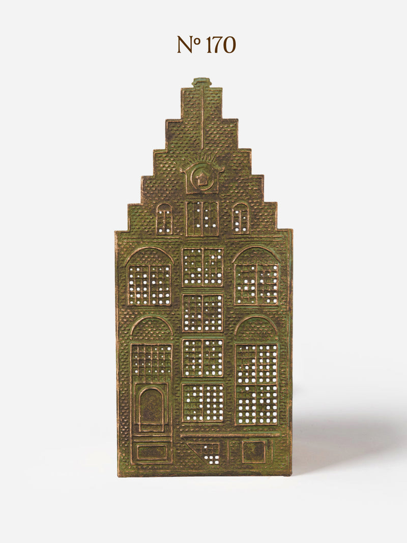 Decorative Canal House candle holder in metal panel by THATCH Living with architectural design on a white background