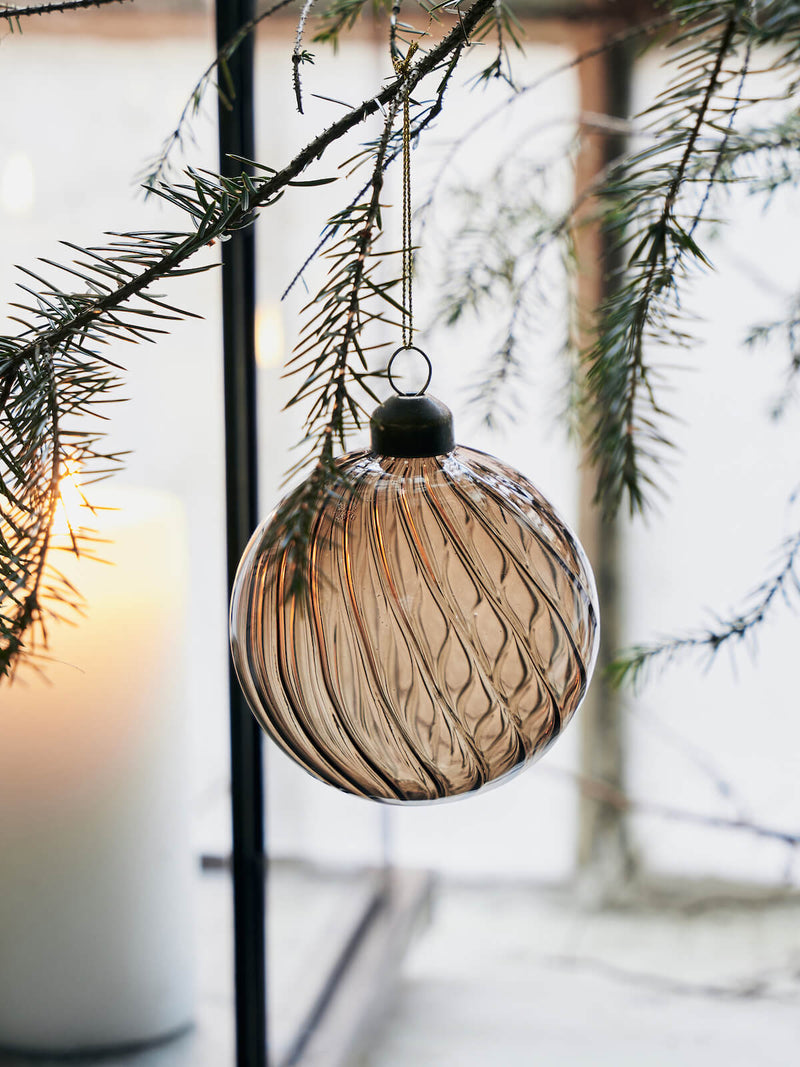 A scandi style Christmas tree with glass baubles.