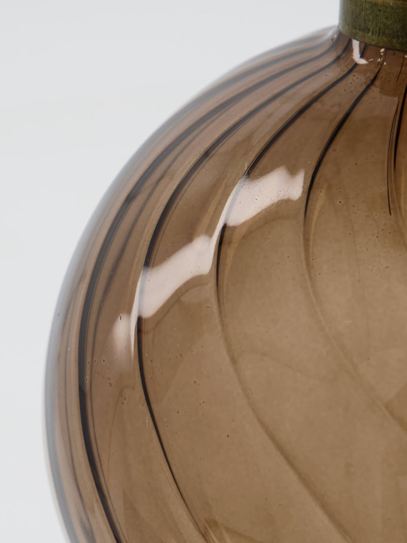 Brown glass bauble of a swirls design scandinavian.