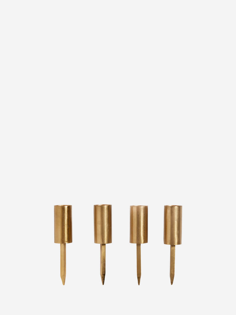 Set of 4 brushed gold candle spikes.