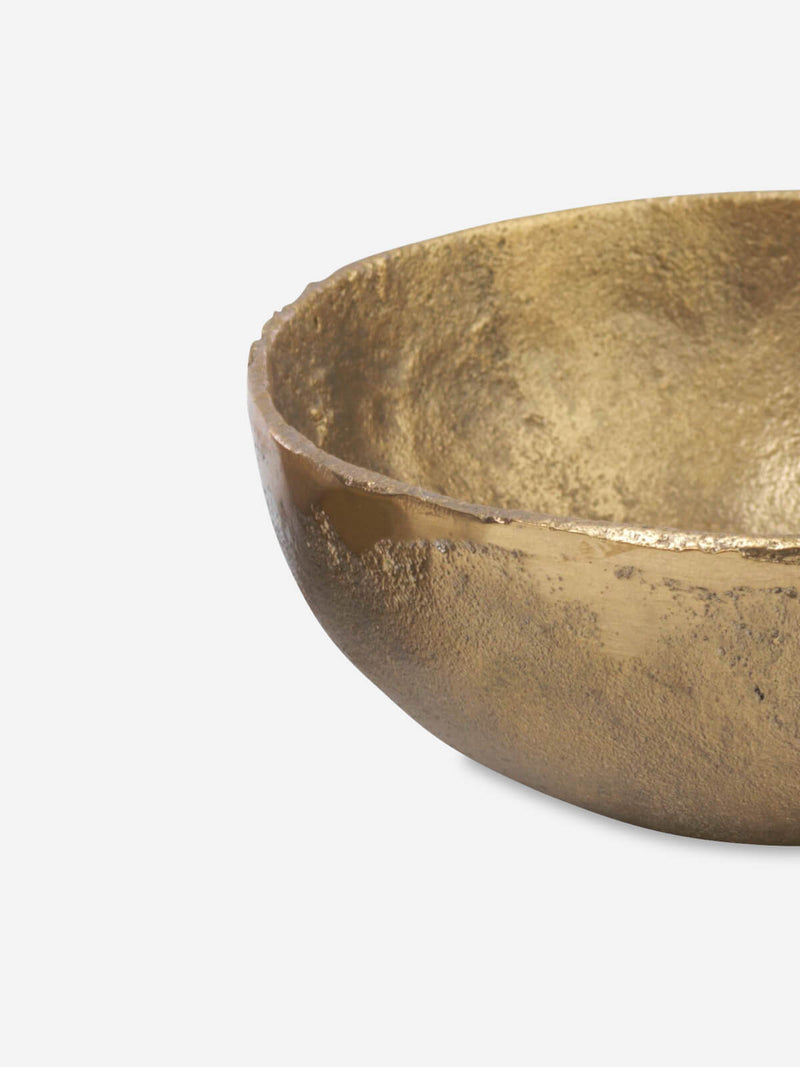 A closeup of a golden jahi bowl
