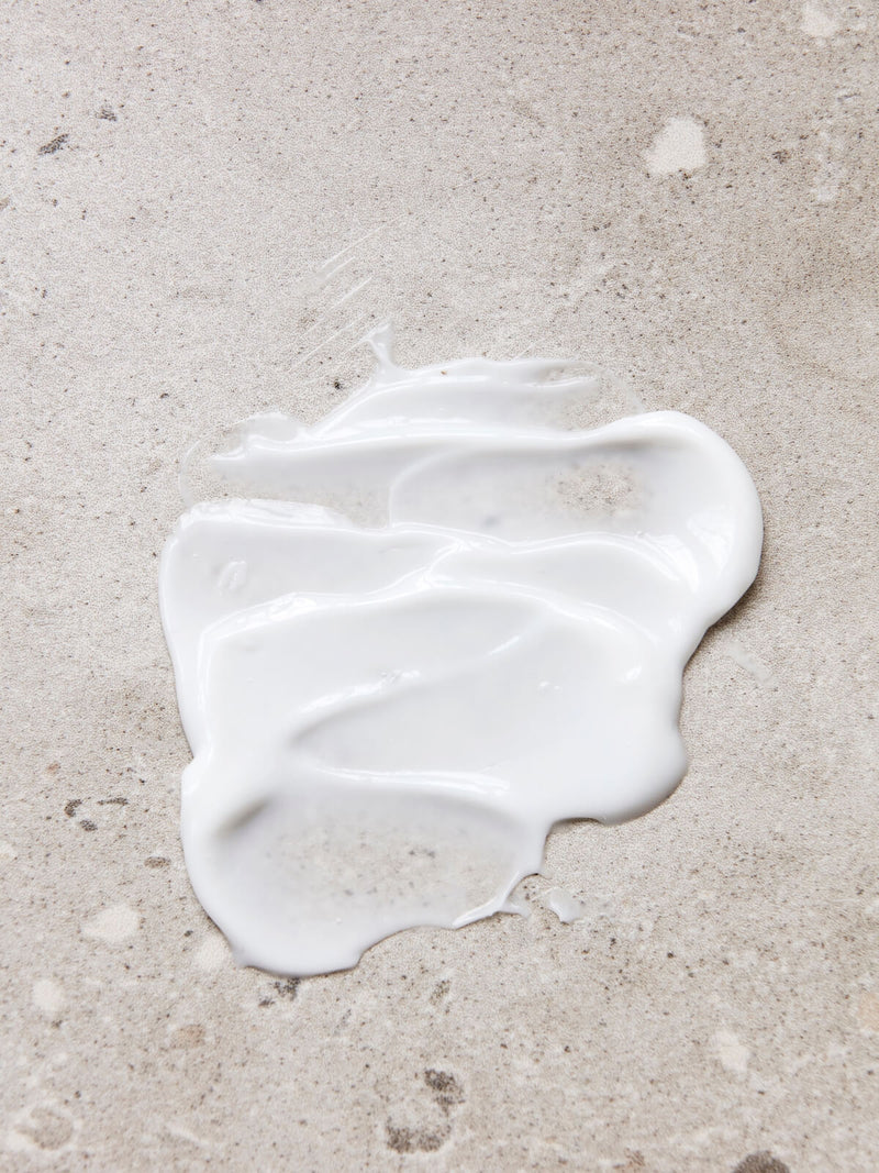 Sample of Meraki linen dew bottle moisturiser hand lotion on marble top.