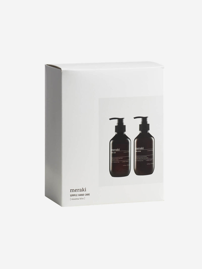 White gift set box of hand soap and lotion on an angle