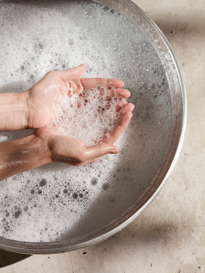 Hands being washed on basin with Meraki Silky Mist hand soap handwash.