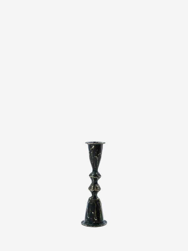 Crafted from iron, the Tarn Candlestick boasts handmade detailing that adds a sophisticated rustic flair to any room, from the dining table to the credenza.